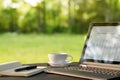 Laptop and coffee in outdoor office Royalty Free Stock Photo