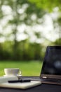 Laptop and coffee, outdoor office