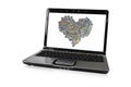 Laptop with coins in heart screen Royalty Free Stock Photo