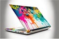 a laptop with a colorful paint splattered design on the screen and keyboard cover, with a white background and a white back