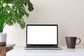 Laptop computer with blank screen for mockup on modern contemporary workspace desk with coffee cup and office supplies. Home Royalty Free Stock Photo