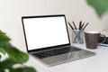 Laptop computer with blank screen for mockup on modern contemporary workspace desk with coffee cup and office supplies. Home Royalty Free Stock Photo