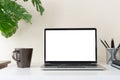 Laptop computer with blank screen for mockup on modern contemporary workspace desk with coffee cup and office supplies. Home Royalty Free Stock Photo