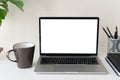 Laptop computer with blank screen for mockup on modern contemporary workspace desk with coffee cup and office supplies. Home Royalty Free Stock Photo