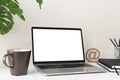 Laptop computer with blank screen for mockup on modern contemporary workspace desk with coffee cup and office supplies. Home Royalty Free Stock Photo