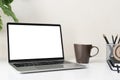 Laptop computer with blank screen for mockup on modern contemporary workspace desk with coffee cup and office supplies. Home Royalty Free Stock Photo