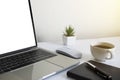 Laptop computer blank screen on white office desk table with coffee cup Royalty Free Stock Photo