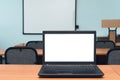 Laptop computer with blank white screen on the desk table. Royalty Free Stock Photo