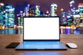 Laptop computer with blank white screen on table. Office concept. Blurred background Royalty Free Stock Photo