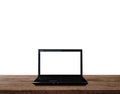 Laptop computer blank white screen, on wood table, isolated on white background. Clipping path included Royalty Free Stock Photo