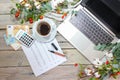 Laptop computer, calculator, money and a coffee cup on a rustic wooden table with autumn branches, seasonal business and finance Royalty Free Stock Photo