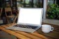 Laptop computer on desk Laptop with blank screen on table in cafe  notebook Home interior or office background Royalty Free Stock Photo