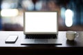 Laptop computer on desk Laptop with blank screen on table in cafe  notebook Home interior or office background Royalty Free Stock Photo