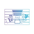 Laptop computer and drawing tools over desk on top view in degraded purple to blue contour Royalty Free Stock Photo