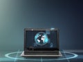 Laptop computer with earth globe on screen Royalty Free Stock Photo