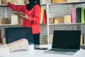 Laptop computer empty screen with shipping box in background Royalty Free Stock Photo