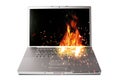 Laptop computer on fire Royalty Free Stock Photo