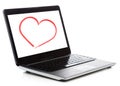 Laptop computer with heart on white screen