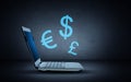 Laptop computer with lighting currency symbols Royalty Free Stock Photo