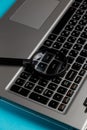 Laptop computer with magnifying glass on blue background, concept of search Royalty Free Stock Photo