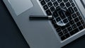 Laptop computer with magnifying glass on dark background, concept of search. Internet security conceptual image Royalty Free Stock Photo