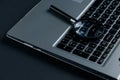 Laptop computer with magnifying glass on dark background, concept of search. Internet security Royalty Free Stock Photo