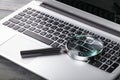 Laptop computer with magnifying glass Royalty Free Stock Photo