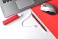 Laptop computer with a mouse, pen, office supplies on a table with copy space, top view, flat layout - a work from home work space Royalty Free Stock Photo