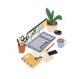 Laptop computer, notebook, coffee cup, business planner, glasses and potted plant. Cozy creative workplace with PC Royalty Free Stock Photo