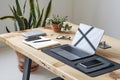 Laptop computer, notebook , smartphone and cup of milk on woode