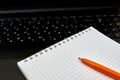 Laptop computer with notepad, pen, keyboard Royalty Free Stock Photo