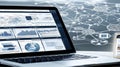 A laptop computer is open to a screen displaying a complex network of data Royalty Free Stock Photo