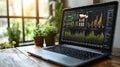 A laptop computer is open to a screen displaying a graph of stock prices Royalty Free Stock Photo
