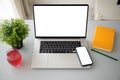 Laptop computer and phone with isolated screen on the table