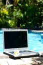Laptop computer and resort pool