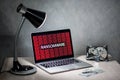 Laptop computer screen with ransomware attack alert
