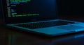 Laptop Computer Screen Showing Green Coding in Dark Environment Royalty Free Stock Photo