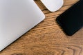 Laptop computer and smartphone, mouse on table. Office concept Royalty Free Stock Photo