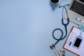 Laptop, stethoscope, clipboard and coffee cup on doctor workspace. Royalty Free Stock Photo