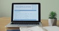 Laptop computer with an Tax application form on its display. Royalty Free Stock Photo