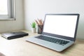 Laptop computer with white blank screen on wood desk. Workspace, workplace, desktop office concept Royalty Free Stock Photo