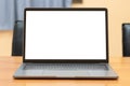 Laptop computer with white blank screen on wood desk. Workspace, workplace, desktop office concept Royalty Free Stock Photo