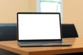 Laptop computer with white blank screen on wood desk. Workspace, workplace, desktop office concept Royalty Free Stock Photo