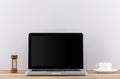 Laptop computer white blank screen on work table front view Royalty Free Stock Photo