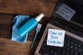 Laptop Computer on wooden table with note CLEAN UP YOUR COMPUTER Royalty Free Stock Photo