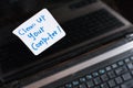 Laptop Computer on wooden table with note CLEAN UP YOUR COMPUTER Royalty Free Stock Photo