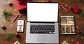 Laptop with copy space on screen, with smartphone,tablet and christmas decorations Royalty Free Stock Photo