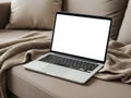 Laptop on couch isolated on white background Royalty Free Stock Photo