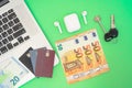 Laptop, credit cards, cash, keys and headphones Royalty Free Stock Photo