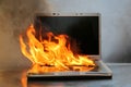 Laptop Damage. Laptop on fire and flames. Computer Repair. Flaming Fire laptop computer Royalty Free Stock Photo